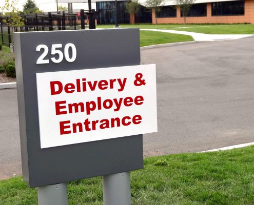 Entrance sign for Delivery and Employees