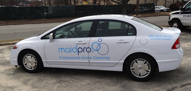 Cut vinyl lettering and logo on a clean white car