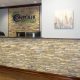 Faux stone in office reception area and behind acrylic logo signage.