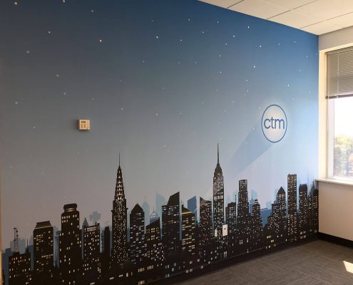 Cityscape wall mural with logo