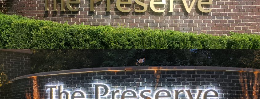 closeup view of The Preserve sign day and night version