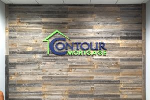 painted dimensional logo on shiplap wall