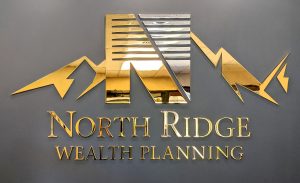 gold metallic dimensional letters and logo